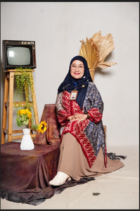 Dewi Okfiwati Roslim, M.Pd
